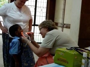 Pastor Jacque helps with health screenings for over 700 children and adults at Family Village Farm in South India.